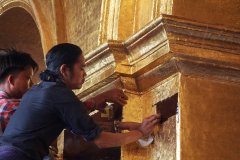 13-Pasting gold leaves on the walls ot the Mahamuni Pagoda
